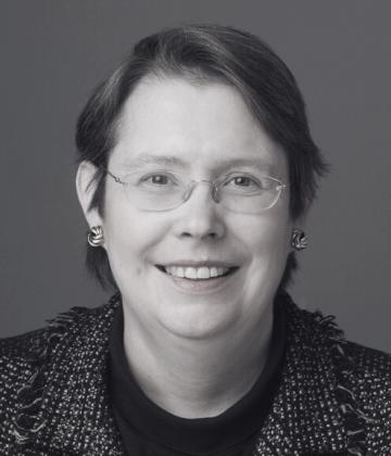 Anne Heal smiling towards the camera