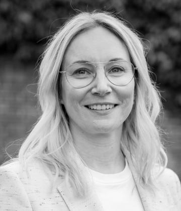 Black and white image of Daisy Houghton, Fundraising Regulator's Head of Communications and Corporate Services