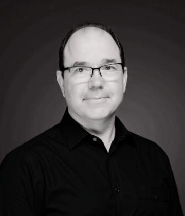 Black and white image of Ian Larkham